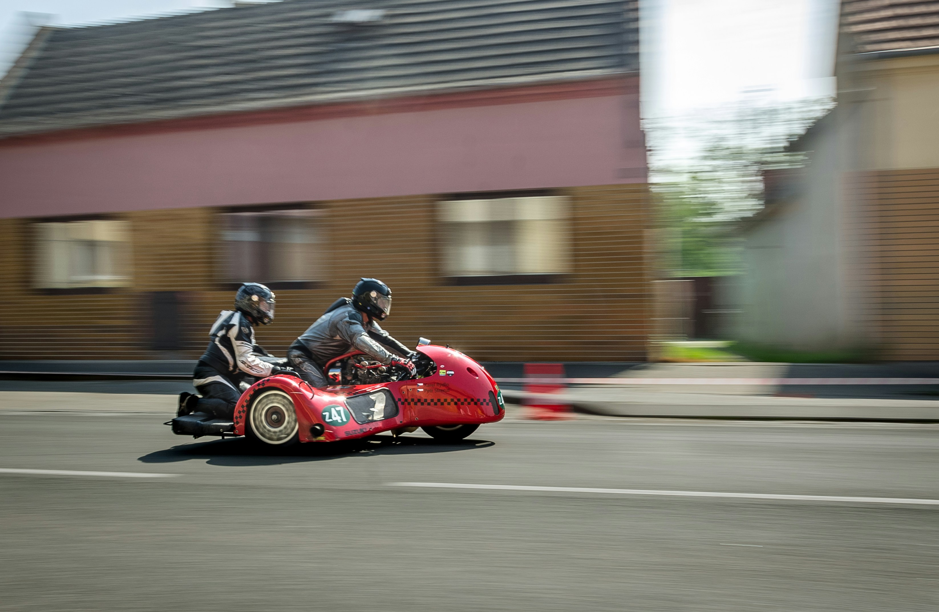 A street-racing motorcycle with an integrated sidecar, in the manner of the Sidehackers from Mystery Science Theater 3000.